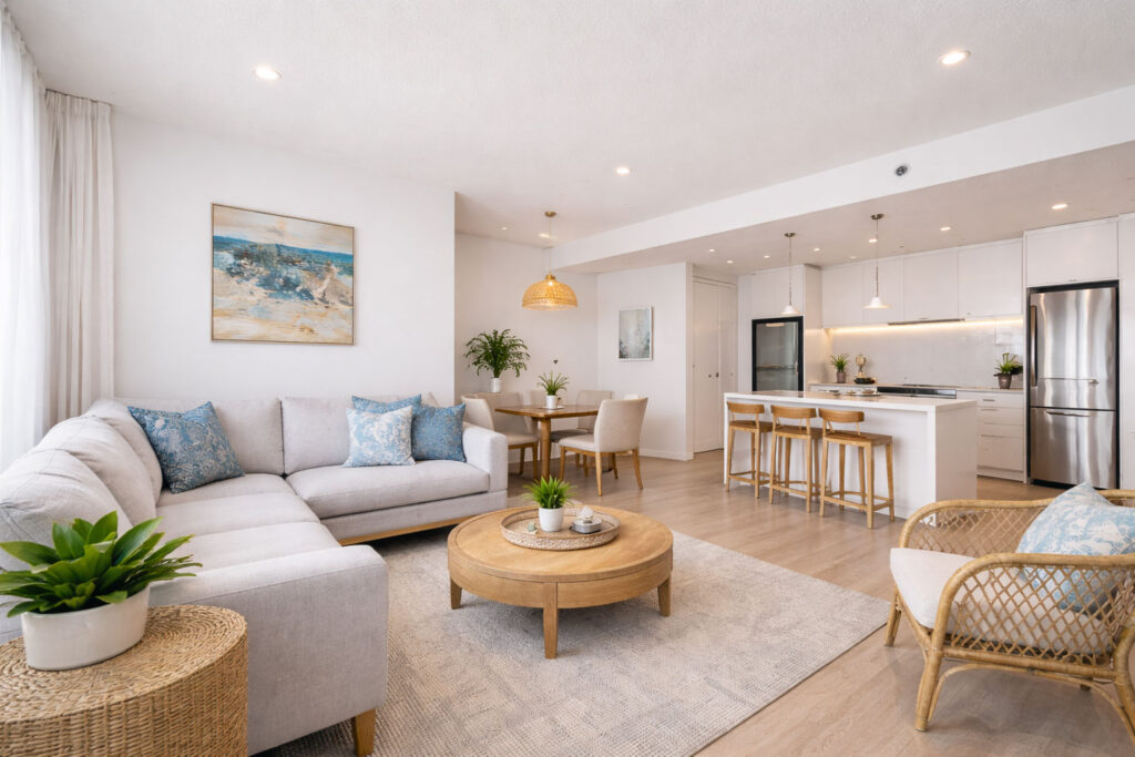 Modern open-plan living and dining area inside a self-contained 1-bedroom apartment on the Gold Coast